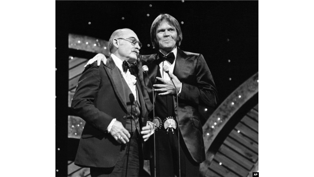 FILE - Glen Campbell and Grandpa Jones at the CMA awards in Nashville in 1978.