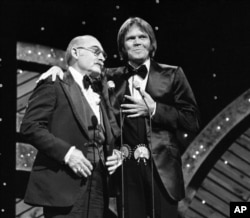 FILE - Glen Campbell and Grandpa Jones at the CMA awards in Nashville in 1978.