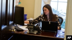 White House deputy press secretary Sarah Huckabee Sanders works in her office at the White House in Washington, March 8, 2017.