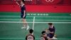 Pebulu tangkis Malaysia, Aaron Chia/Soh Wooi Yik, merayakan kemenangan atas pasangan Indonesia Marcus Fernaldi Gideon/Kevin Sanjaya Sukamuljo pada laga perempat final ganda putra Olimpiade Musim Panas 2020, Kamis, 29 Juli 2021, di Tokyo, Jepang.