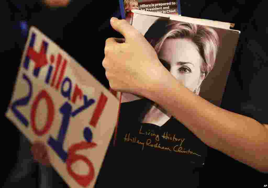 Patrick Chappel of Columbus, Georgia, holds a copy of Democratic presidential candidate Hillary Clinton&#39;s book while waiting to enter a campaign event at the Old City Council Chambers in City Hall in Atlanta. Democrats vote in a primary in South Carolina on Saturday.