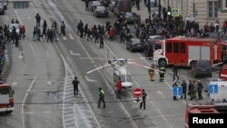 General view of emergency services attending the scene outside Sennaya Ploshchad metro station, following explosions in two train carriages in St. Petersburg, Russia April 3, 2017. REUTERS/Anton Vaganov