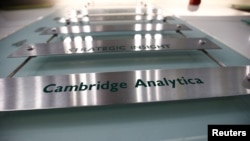 The nameplate of political consultancy, Cambridge Analytica, is seen in central London, Britain, March 21, 2018. 
