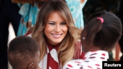 U.S. first lady Melania Trump greets children during a visit to a hospital in Accra, Ghana, Oct. 2, 2018.