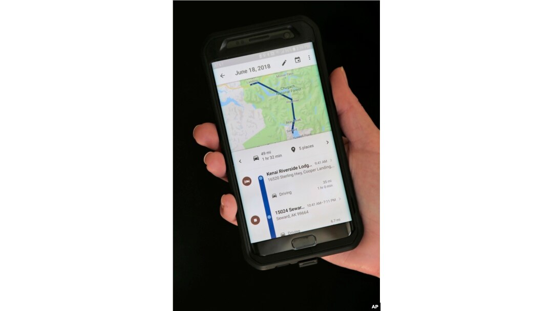 In this Wednesday, Aug. 8, 2018, photo a mobile phone displays a user's travels in New York. (AP Photo/Seth Wenig)