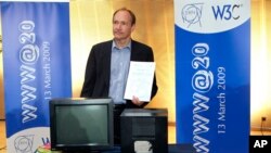 Tim Berners-Lee, inventor of the World Wide Web, stands next to the first Web server that ran on this NeXT computer, during the 20th anniversary celebration of the Web at the European Organisation for Nuclear Research (CERN) in Switzerland
