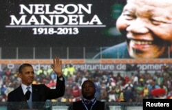 FILE - U.S. President Barack Obama addresses the crowd during a memorial service for Nelson Mandela at FNB Stadium in Johannesburg, Dec. 10, 2013.