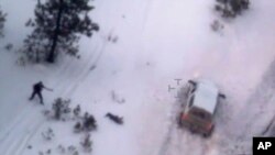 This photo taken from an FBI video shows Robert "LaVoy" Finicum, the figure in the center of the photo, after he was fatally shot by police near Burns, Ore., Jan. 26, 2016. 