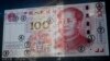 El yuan sube frente al dólar pero las bolsas chinas caen