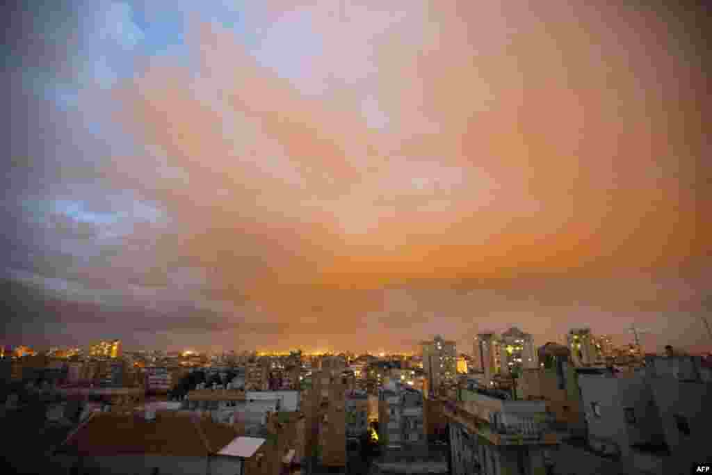 A cloud of sand suspended in the air passes over the Mediterranean coastal city of Netanya in the center of Israel.