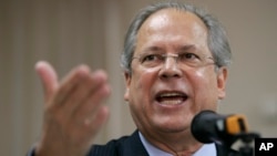 FILE - Former chief of staff Jose Dirceu gestures during a news conference in Sao Paulo, Brazil, Aug. 30, 2007. 