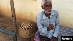 FILE - Rescued bonded laborer Srikrushna Rajhansiya recalls his days in bondage outside his home in Sargul village in the eastern Indian state of Odisha, August 31, 2016. 