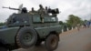Uganda People's Defence Forces (UPDF) soldiers ride on their armored personnel carrier (APC) enroute to evacuate their citizens following recent fighting in Juba at Nimule town along the South Sudan and Uganda border, July 14, 2016.