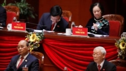 Vietnam's President and General Secretary of the Communist Party Nguyen Phu Trong (R, bottom) and Prime Minister Nguyen Xuan Phuc (L, bottom) attend the closing ceremony of the 13th national congress of the ruling communist party of Vietnam at the National Convention Center in Hanoi, Vietnam February 1, 2021. The Vietnamese communist party has been greatly enforcing its laws against political disapproval messages online in recent years through social media sites like Facebook. (REUTERS/Kham)