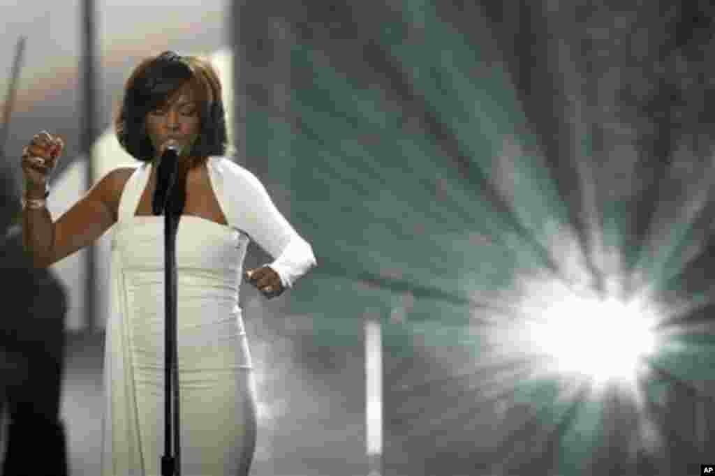 In this Nov. 22, 2009, file photo, Whitney Houston performs at the 37th Annual American Music Awards in Los Angeles. Houston died Saturday, Feb. 11, 2012, she was 48. (AP Photo/Matt Sayles)