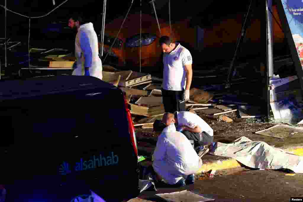 Forensic experts work outside Turkey's largest airport, Istanbul Ataturk, following a blast in Turkey, June 28, 2016. 