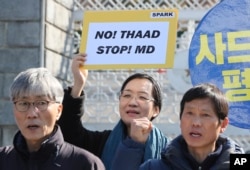 Protesters shout slogans during a rally to oppose the plan to deploy the Terminal High-Altitude Area Defense system, or THAAD, in front of the Defense Ministry in Seoul, March 7, 2017.