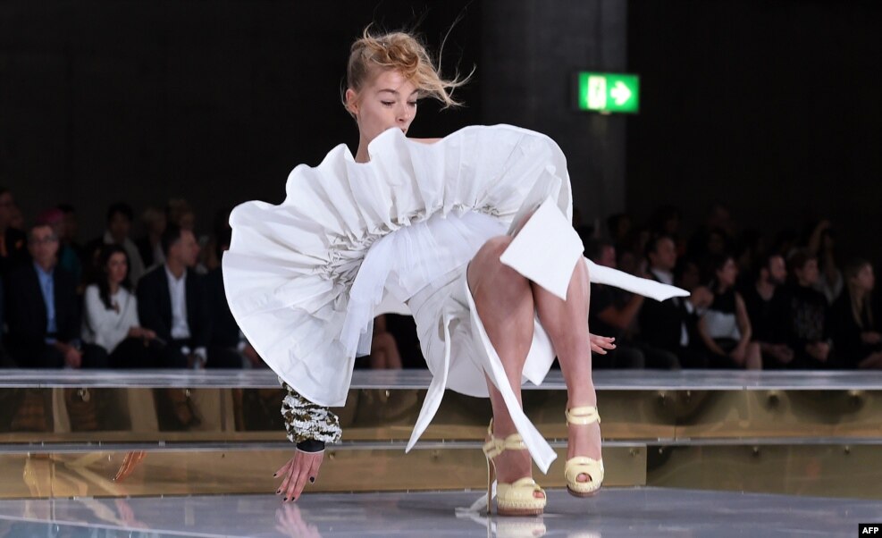 A model slips on the runway while parading an outfit by Australian designer Toni Maticevski at Fashion Week Australia in Sydney.