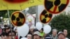 Anti-Nuclear Demonstrators Confront Japan's PM