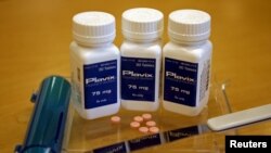 FILE - Bottles of Plavix shown on display at a pharmacy in North Aurora, Illinois, July 24, 2008. 