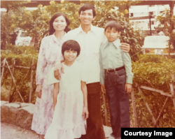 Sonny Duong with his parents, and sister in Hong Kong, outside the refugee camp where they lived after Vietnam, 1980.