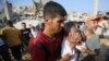 Israel Pounds Gaza; Netanyahu Warns of Long Campaign