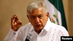 FILE - Andres Manuel Lopez Obrador, leader of the National Regeneration Movement (MORENA), speaks during a news conference in Mexico City, Mexico, June 9, 2017.