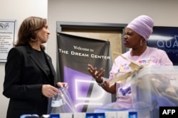 FILE - U.S. Vice President Kamala Harris speaks with a worker on Oct. 5, 2024, as she helps prepare hygiene care packages at a health clinic where the N.C. Counts Coalition nonprofit is preparing then delivering them to victims of Hurricane Helene in Charlotte, North Carolina.