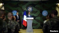 FILE - French President Francois Hollande gives a speech at the French Military base Sangaris Mpoko in Bangui, Central African Republic, May 13, 2016. Hollande announced on June 13, 2016, that France will end a three-year military peacekeeping operation in CAR in Oct.