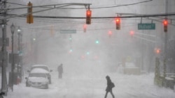 Pedestrians make their way through heavy snow and wind in Hoboken, N.J., Monday, Feb. 1, 2021. (AP Photo/Seth Wenig)