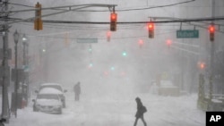 Pedestrians make their way through heavy snow and wind in Hoboken, N.J., Feb. 1, 2021.