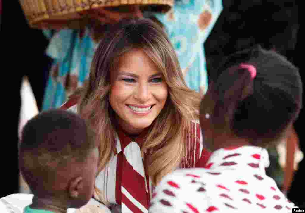 U.S. first lady Melania Trump greets children during a visit to a hospital in Accra, Ghana, Oct. 2, 2018.