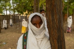 Alem Gebreslase, a 24-year-old parishioner, says she would die to protect the Ark of the Covenant which is believed by the Orthodox Ethiopians to be in a church in Axum, Ethiopia, June 13, 2021. (Yan Boechat/VOA)