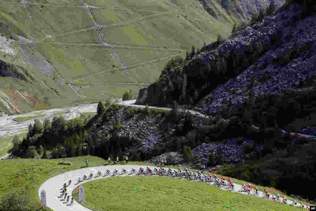 Cyclists climb Cormet de Roselend during Stage 18 of the Tour de France cycling race, which covers 175 kilometers (108.7 miles) from Meribel to La Roche-sur-Foron, France.