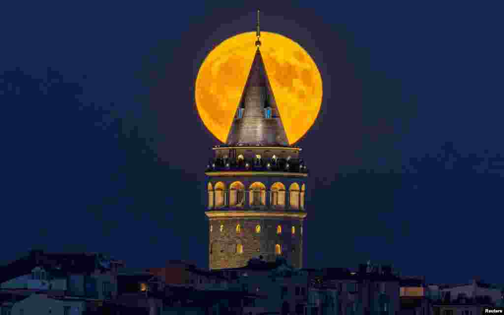 A supermoon rises over the historical Galata Tower in Istanbul, Turkey, on Aug. 19, 2024.