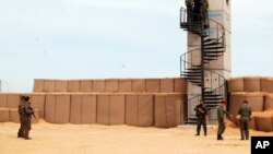 FILE - Tunisian soldiers take part in a presentation of the anti-jihadi fence near Ben Guerdane, eastern Tunisia, close to the border with Libya, Feb. 6, 2016. Western militaries are helping advise Tunisian forces as concerns grow about militants in Libya.