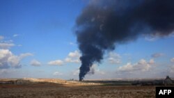 
1
An exiled Tibetan holds a placard as he participates in a protest in Dharmsala, India, against the demolition of buildings in Larung Gar by Chinese authorities. Larung Gar is an area in eastern Tibet housing Buddhist institutions and thousands of monks and nuns.