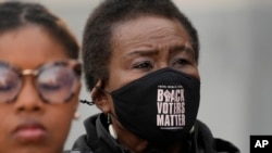 FILE - Carol Blackmon, Mississippi Coordinator for Black Voters Matter, joins members of other voting rights groups at a news conference in Jackson, Miss., on December, 2023. 