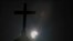 FILE—A partial solar eclipse is seen behind a cross on the steeple of the St. George church, in downtown Beirut, Lebanon, Sunday, June 21, 2020.
