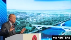 Turkish President Tayyip Erdogan speaks during the groundbreaking ceremony of Sazlidere Bridge over the planned route of Kanal Istanbul, in Istanbul, Turkey, June 26, 2021.