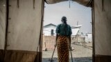 The 42-year-old mother of four who was raped in the Bulengo displacement camp where she had fled war in eastern Democratic Republic of Congo poses for a photograph Aug. 23, 2023.