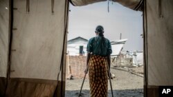 The 42-year-old mother of four who was raped in the Bulengo displacement camp where she had fled war in eastern Democratic Republic of Congo poses for a photograph Aug. 23, 2023.