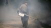 A worker sprays insecticide for mosquitos in Bangkok, Thailand, Jan. 13, 2016. Tropical Southeast Asian countries said they were bracing for the Zika virus, with Malaysia saying it could "spread quickly" if introduced. 