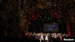 Cast and crew members take a final bow as confetti is released after the final performance of the Phantom of the Opera, which closes after 35 years on Broadway, in New York, April 16, 2023.