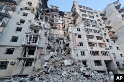 A building stands heavily damaged on Feb. 20, 2025, after a Russian strike in Kherson, Ukraine. (Kherson Regional Military Administration via AP)