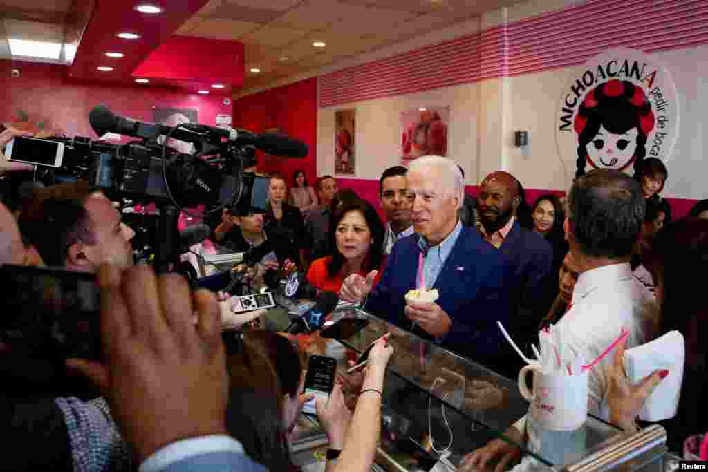 Democratic U.S. presidential candidate and former U.S. Vice President Joe Biden talks to reporters after ordering ice cream at La Michoacana during the state&#39;s Super Tuesday Democratic presidential primary election in Los Angeles, March 3, 2020.