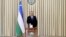 Uzbek President Shavkat Mirziyoyev casts his ballot at a polling station during the presidential election in Tashkent, Oct. 24, 2021.