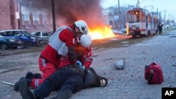 In this photo provided by Ukrainian forces on Jan. 8, 2025, paramedics work to resuscitate a man injured in a Russian strike in Zaporizhzhia, Ukraine. (Zaporizhzhia regional military administration via AP)