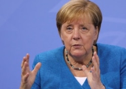 German Chancellor Angela Merkel speaks during a news conference at the Chancellery in Berlin on Aug. 10, 2021.