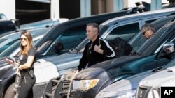 Brazilian businessman Eike Batista, center, is escorted to a police station in Rio de Janeiro, Brazil, Aug. 8, 2019. 